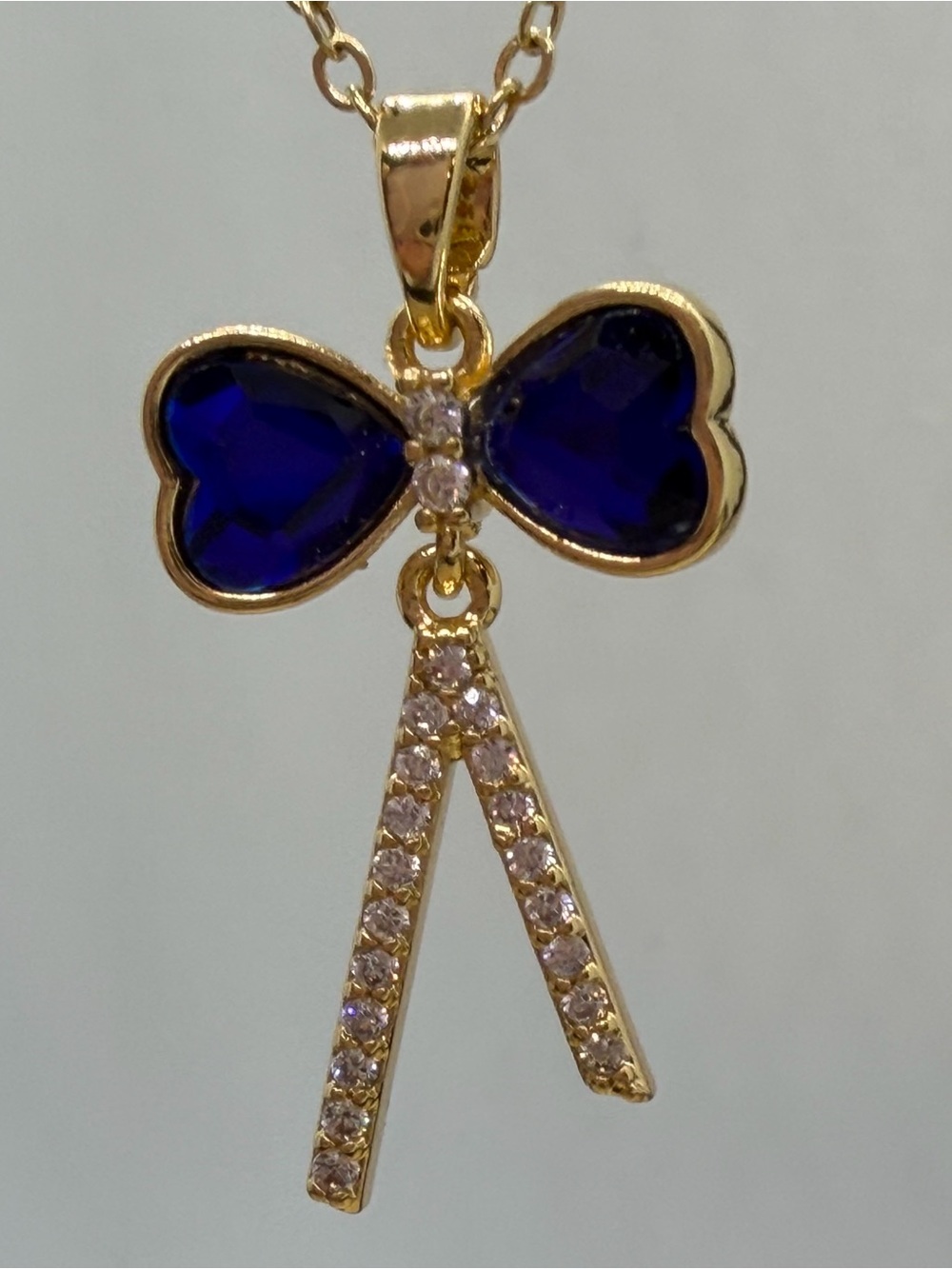 Gold-Tone Blue Crystal Bow Pendant Necklace